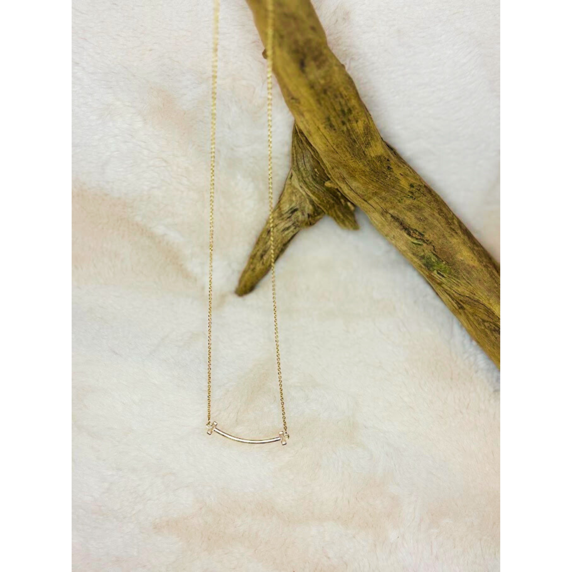 16 inch gold curved bar necklace with CZ stones