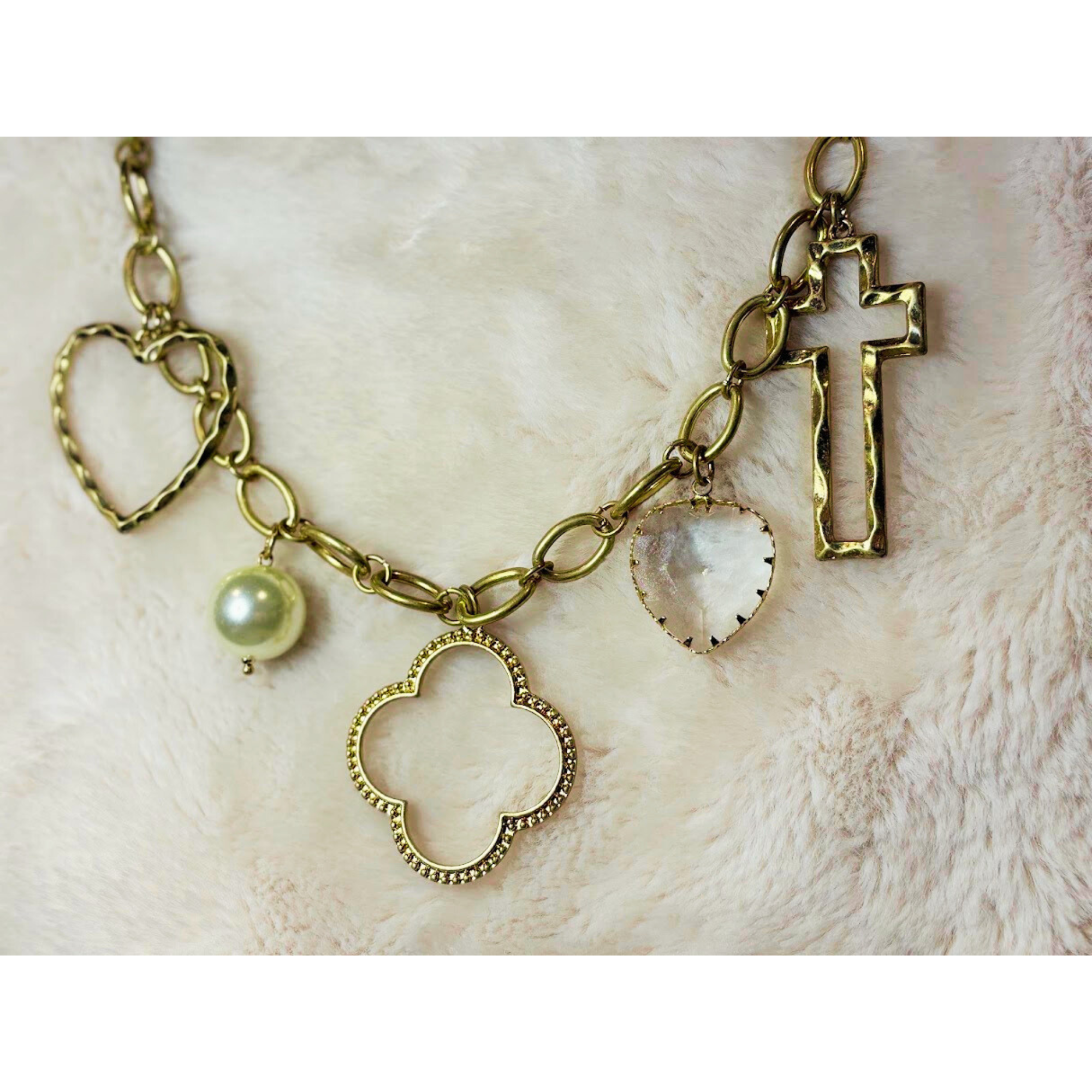 17 inch gold necklace with pearl, heart, clover and cross charms