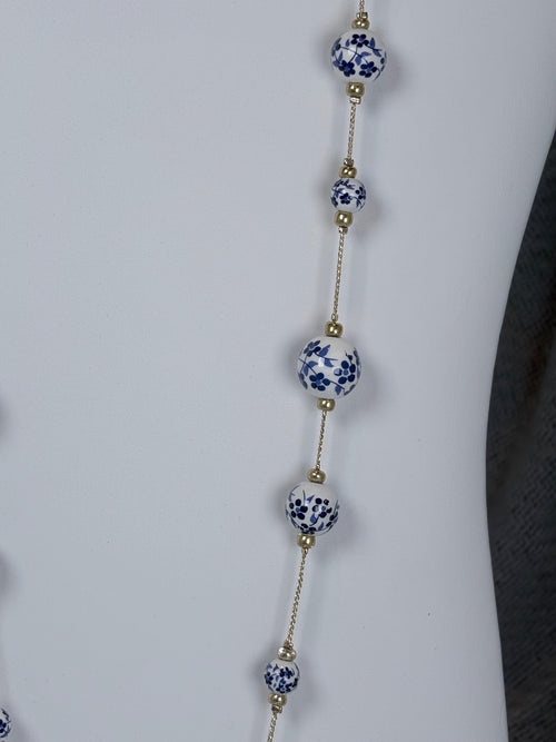 33 inch gold tone necklace with white and blue cottage core beads